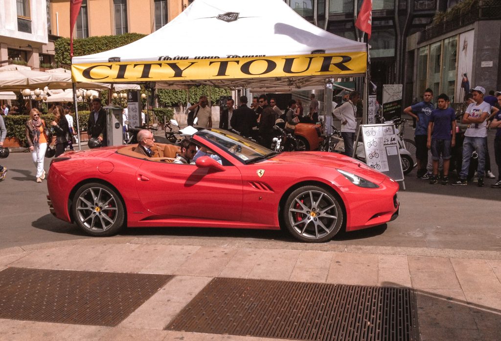 A red Ferrari outside City Tour in Milan
