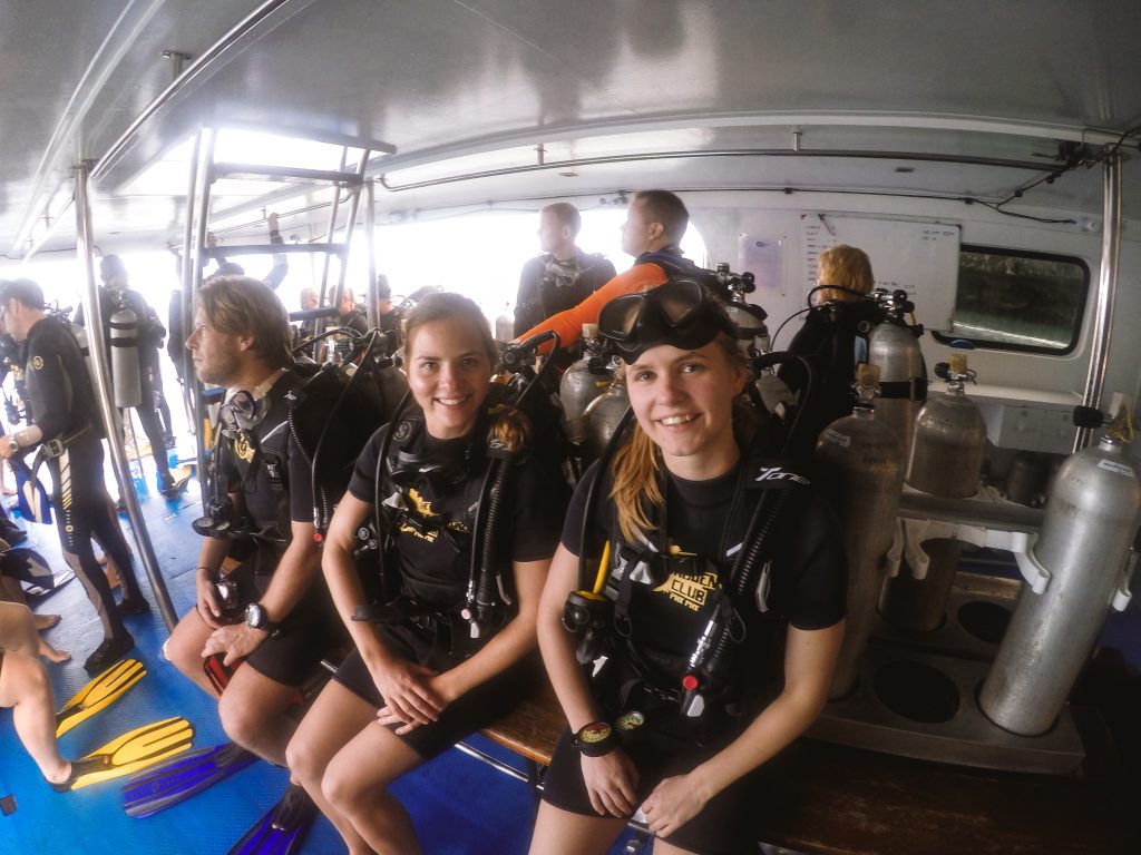 Two women dressed in scuba diving gear ready to go scuba diving in Thailand